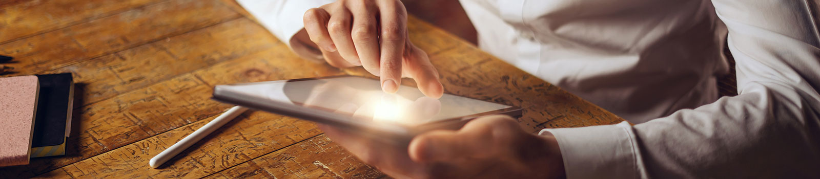 Close up of person using tablet
