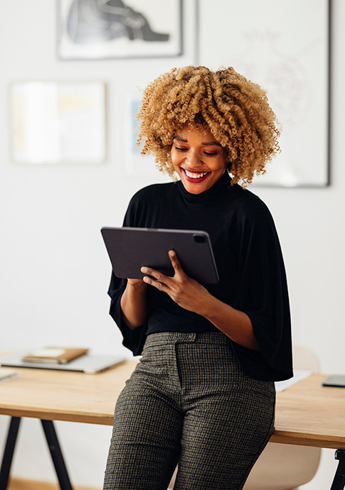 Businesswoman using tablet in home office