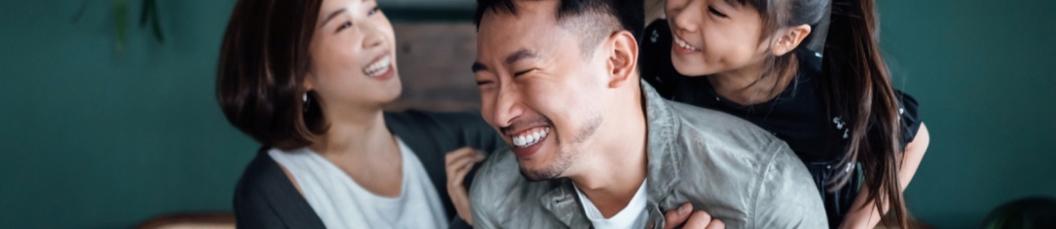 a family smiling and laughing