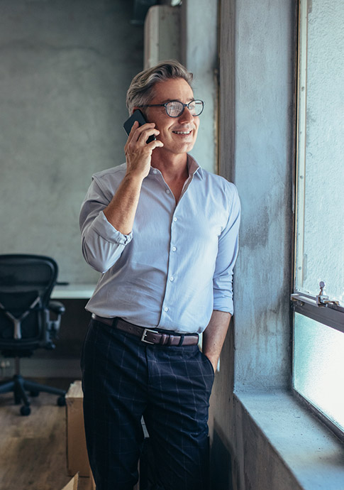 Businessman talking on phone in office