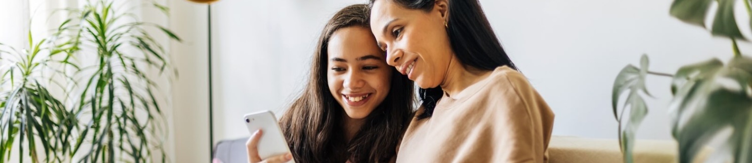 a mother and daughter taking a selfie
